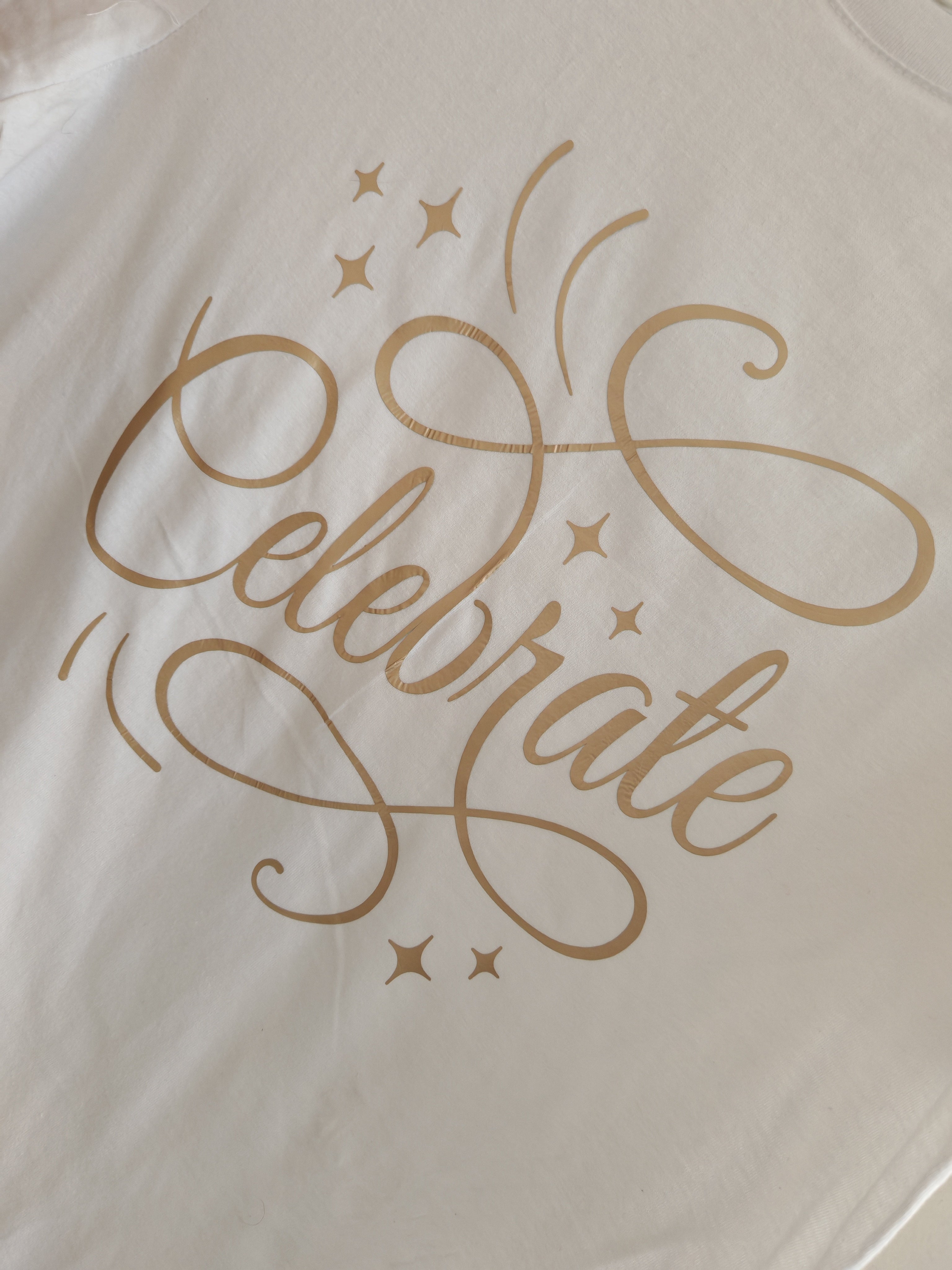 Celebrate Artistic Script T-Shirt – Elegant Festive Graphic Tee